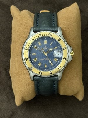 Burett B1520CD Quartz Watch Blue Dial Roman Numerals Date Gold Bezel 100m