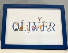 Oliver baby name print with animal decor in free standing picture frame