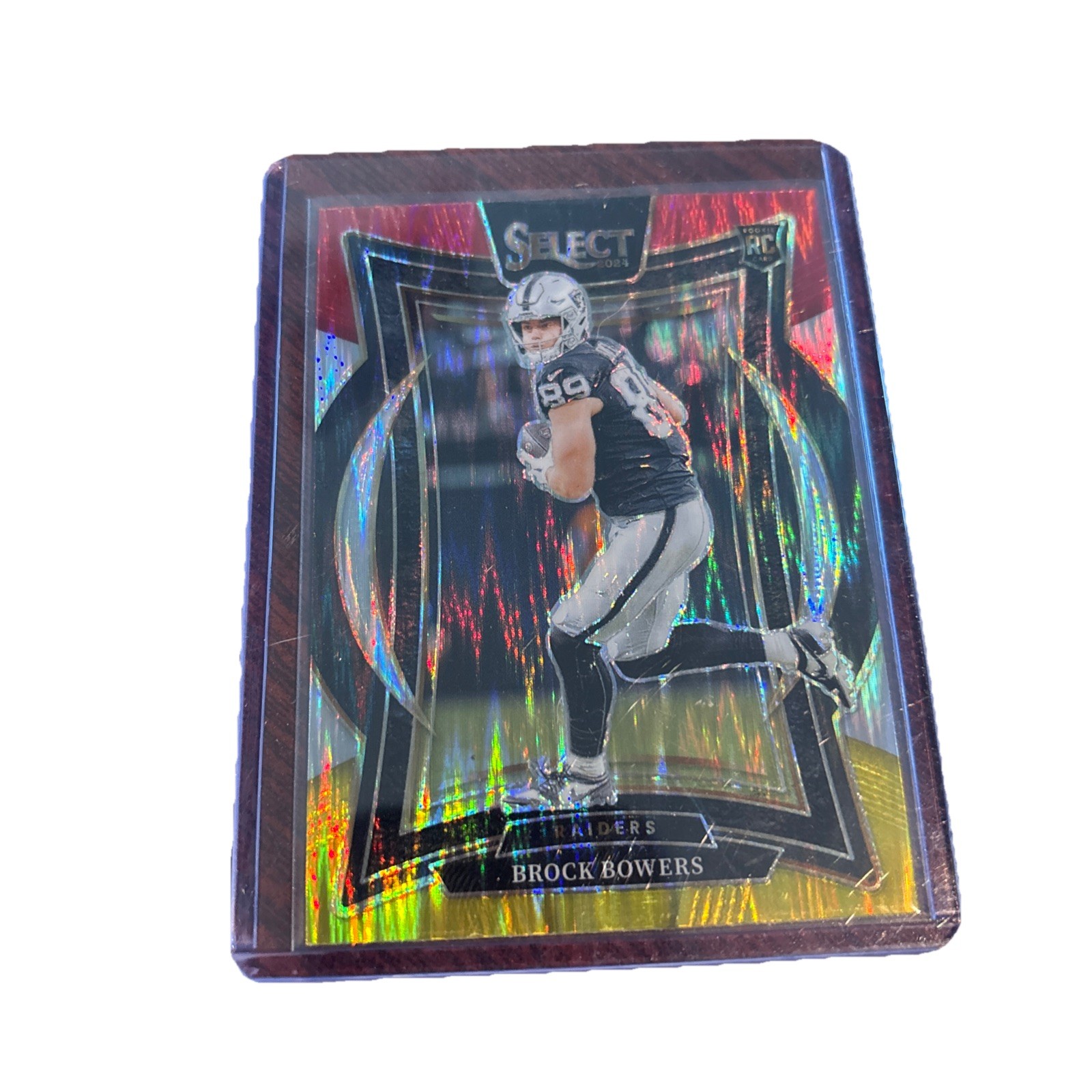 2024 Panini Select - Concourse Brock Bowers #31 Red & Yellow Shock Prizm (RC)