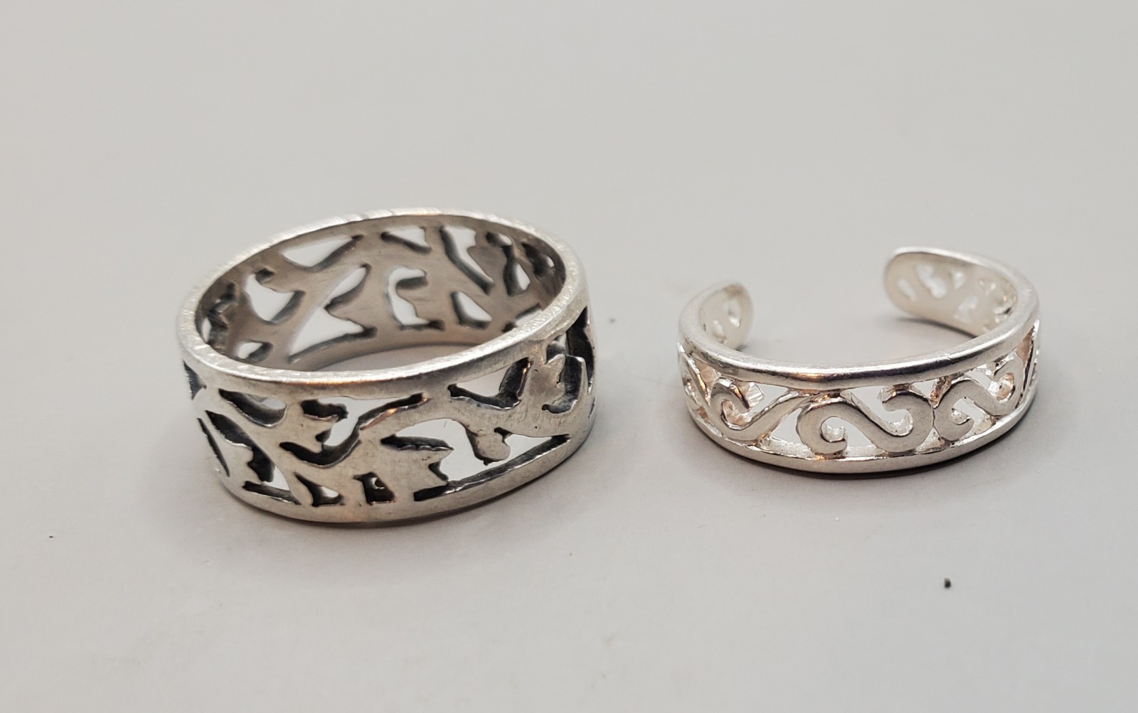2 Pc. 925 Sterling Silver: Cut-out Floral Band Ring Sz 4.5, Adj. Scroll Toe Ring