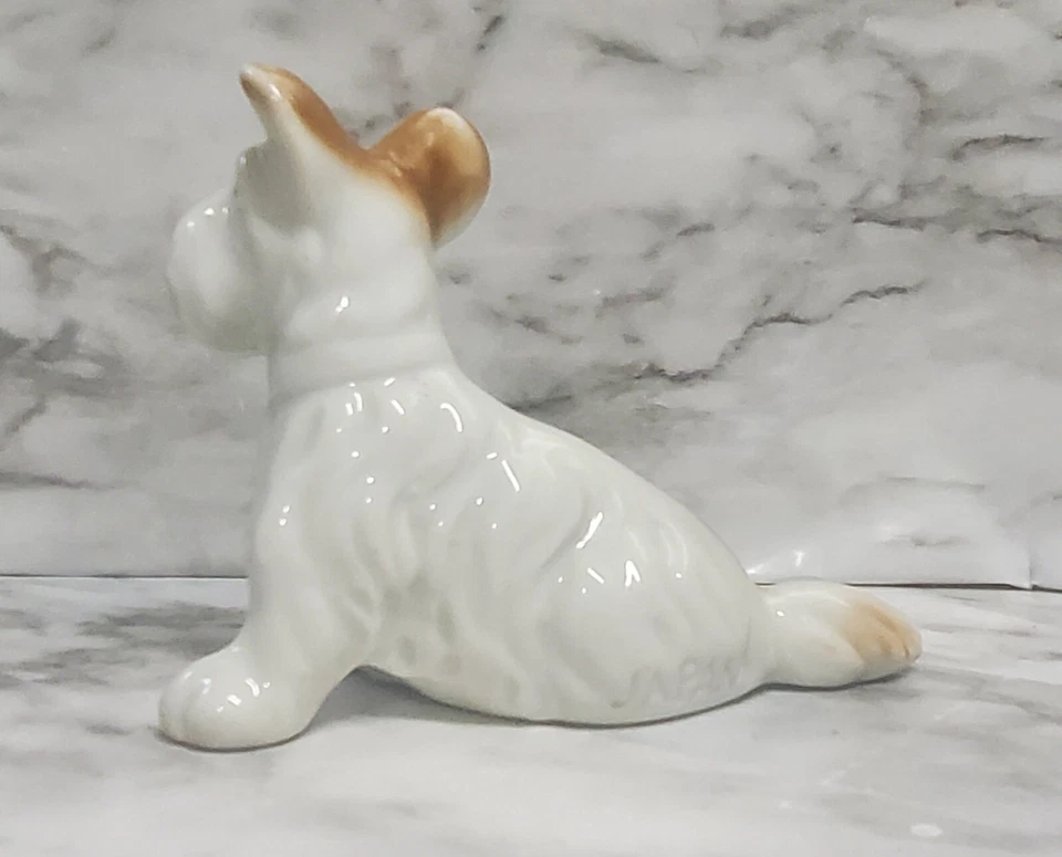 Estatueta Terrior. Cerâmica. Branco e marrom. Cabelo longo. Orelhas alegres. Cauda longa... - Imagem 3 de 4