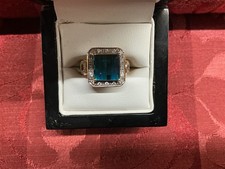 18cy gold diamond and tourmaline emerald cut ring