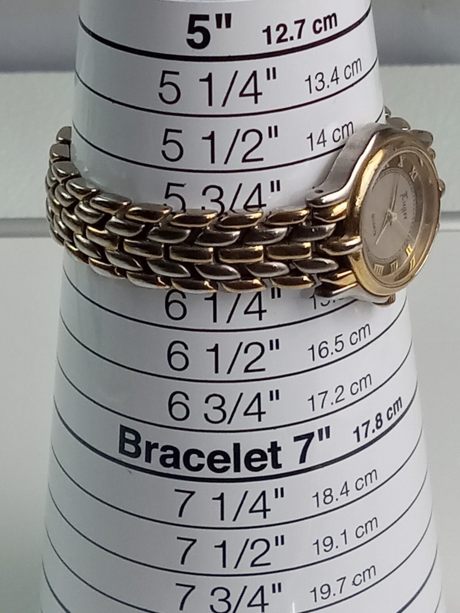 Vintage Luger Swiss made watches in silver and gold tone two Vintage Luger Swiss made watches in silver and gold tone two