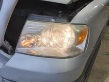 Used Left Headlight Assembly Fits 2005 Ford F150 Pickup Bright Background Left Used Left Headlight Assembly Fits 2005 Ford F150 Pickup Bright Background Left