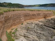 Photo 6x4 Coastal erosion on Wembury Bay Layers of topsoil on bedrock bei c2011