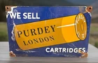 VINTAGE 11 3/4” X 8” JAMES PURDEY PORCELAIN ENAMEL GUN AMMO LONDON UK SIGN