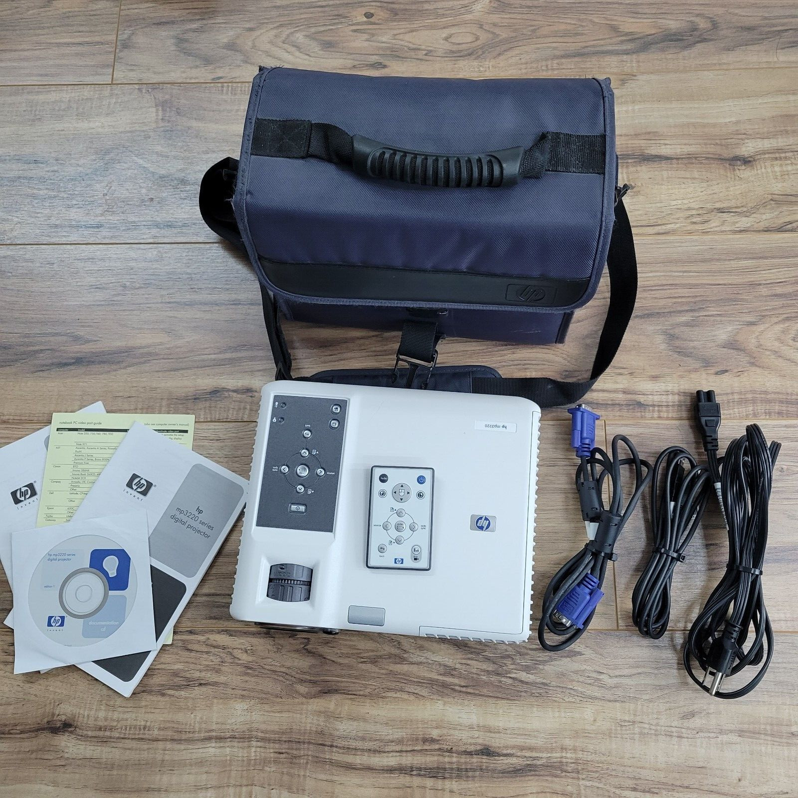 HP MP3220 DLP Projector, with all cables, travel bag, and documentation.