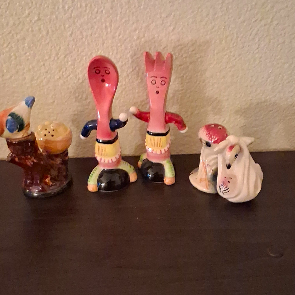 Genuine 1950s ceramic novelty shakers — the kind of kitschy tabletop charm that makes any kitchen shelf instantly more interesting.