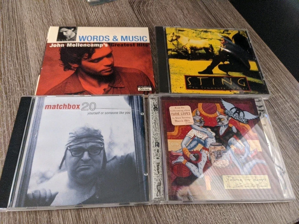 CD Music Lot Mixed Aerosmith, The Beatles, Bon Jovi, Foo Fighters Foto 3 de 4