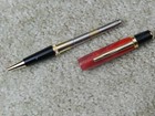Red twist Pen With Reflective Highlights & Appears to Change Shades W/ Lighting — photo 4