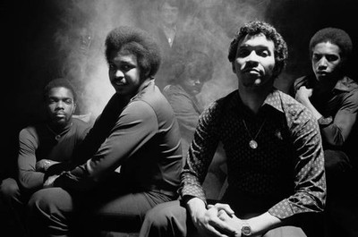 Heatwave funk disco band pose in a darkly lit group studio portrai- Old Photo