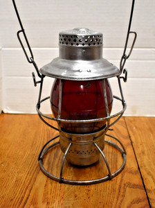 M.L.&T.RR&SSCo. Adlake Reliable lantern with red globe.