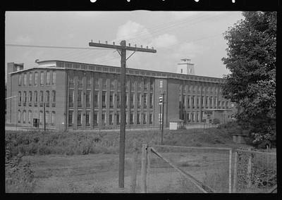 Photo:1930s Industrial Brick Factory Building Utility Pole Fence