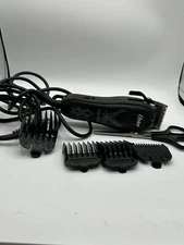Oster Aspire adjustable magnetic Omotor clipper with 4 different cutting guides.