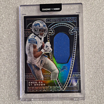 Panini Obsidian 2023 Amon-Ra St. Brown Lions Sharpened Swatches SSW-AST /199
