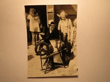 Kids Watching Woman With Spinning Wheel / Photo
