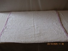 NEW HAND KNITTED BABY BLANKET IN WHITE SPARKLE WITH MAUVE TRIM SIZE 29" x 24".
