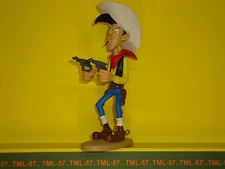 Figurine Atlas LUCKY LUKE 2003 d'après Marie LEBLON - Lucky Luke tirant 2 colts