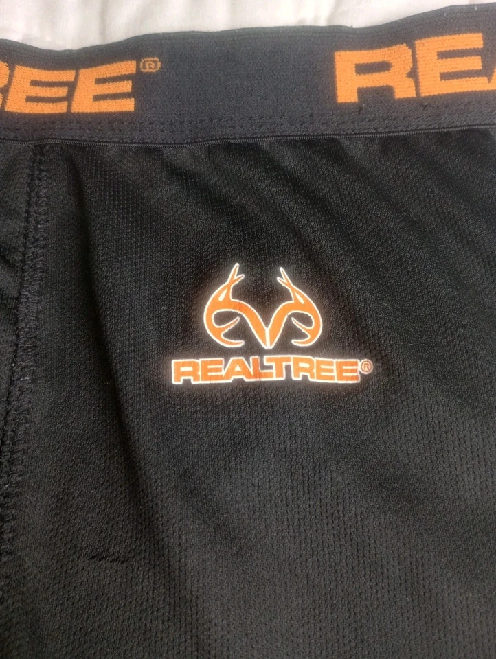 Parte inferior de capa base grande RealTree para hombre mosca abierta negra con logotipo naranja  Foto 2 de 4