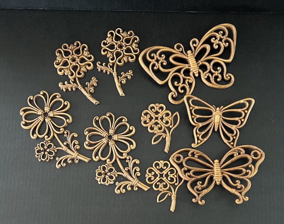 A genuine 9-piece 1970s Homco plastic rattan butterfly & flower wall set — this is peak retro kitsch that's cycling back hard into cool-again territory.