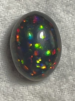 16.9 ct Incredible Natural Rainbow Black Opal Cabochon treated GIA Certified