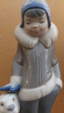 Lladro  Porcelain Figurine of Eskimo Child and Polar Bear Cub. 5238