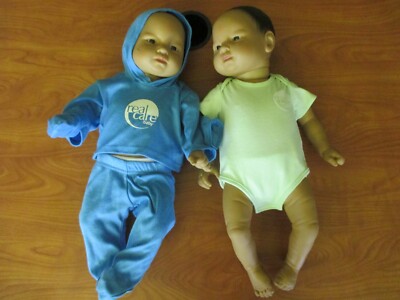 Lot of 2 RealityWorks-Reality Baby II Plus W/Clothing/Diaper 1 Male 1 Fema Asian