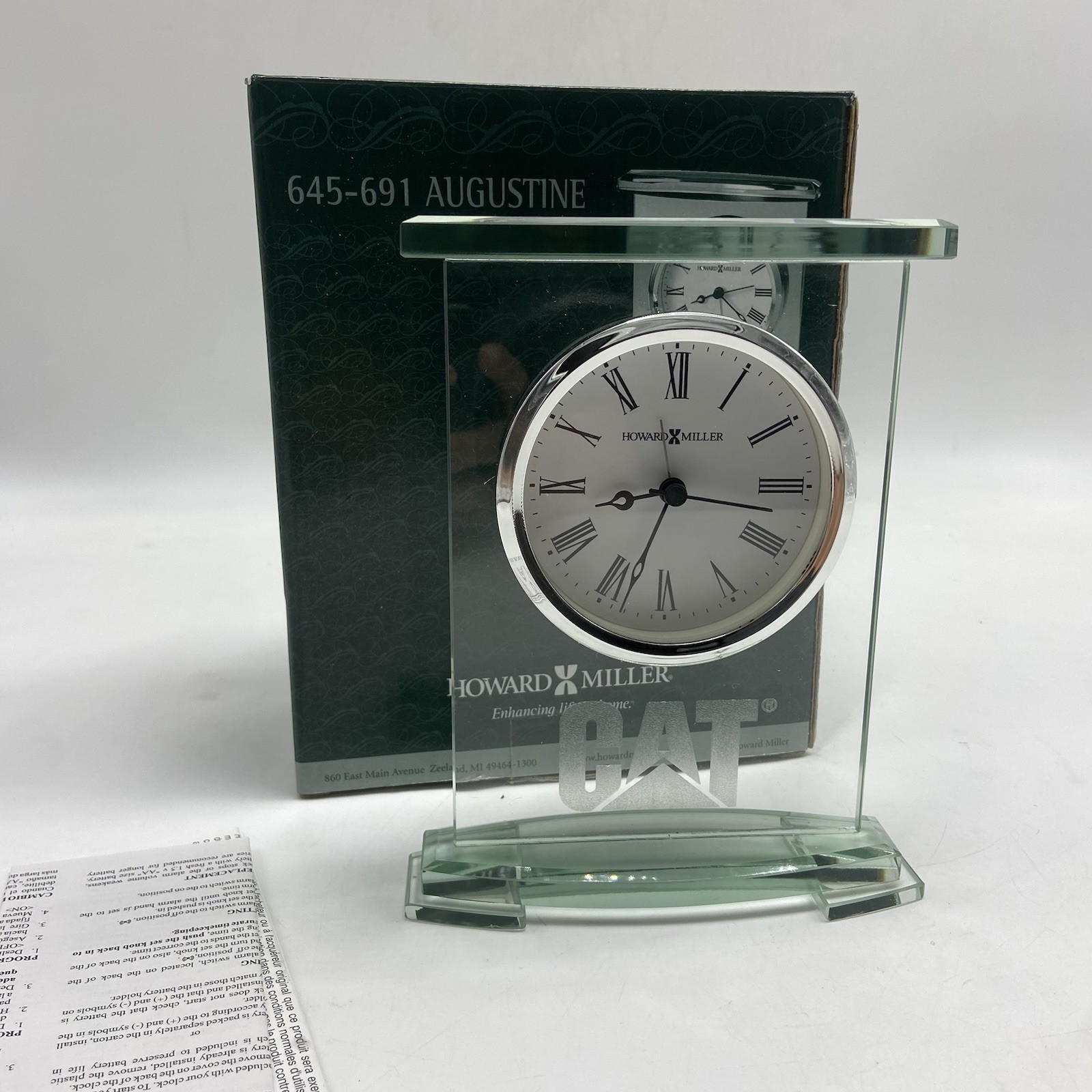 Howard Miller 645-691 Augustine Glass Quartz Tabletop Clock Caterpillar Logo