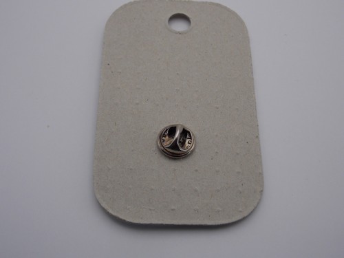 The Shell Garden Jersey pin badge shell shape with two dolphins - Picture 2 of 2