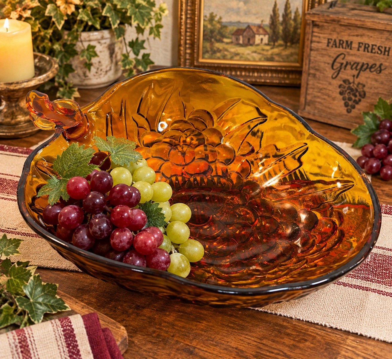 Amber glass footed bowl with grape and leaf pattern