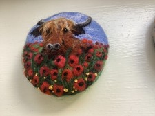 NEEDLE FELT BROOCH HIGHLAND COW IN POPPY MEADOW