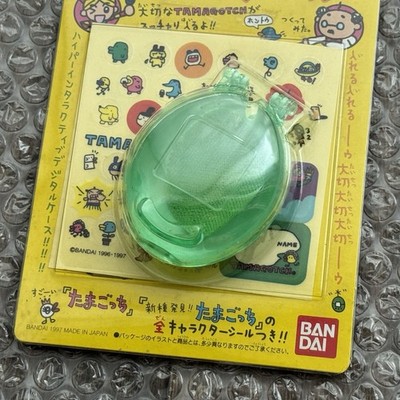 Bandai 1997 Official Tamagotchi New Species Clear Green Case +