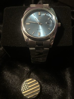 IIK Collection GB980 quartz watch featuring a sunburst light blue dial.