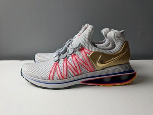 nike shox gravity vast grey metallic gold