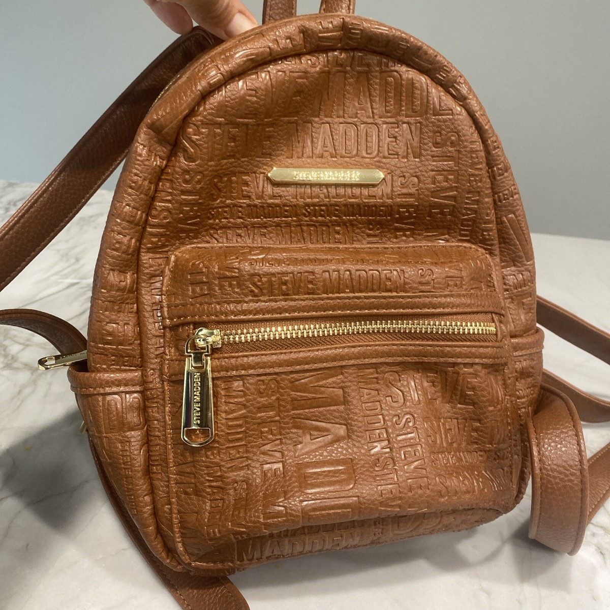 Steve Madden Small Textured logo Faux Leather Backpack With Gold Accents