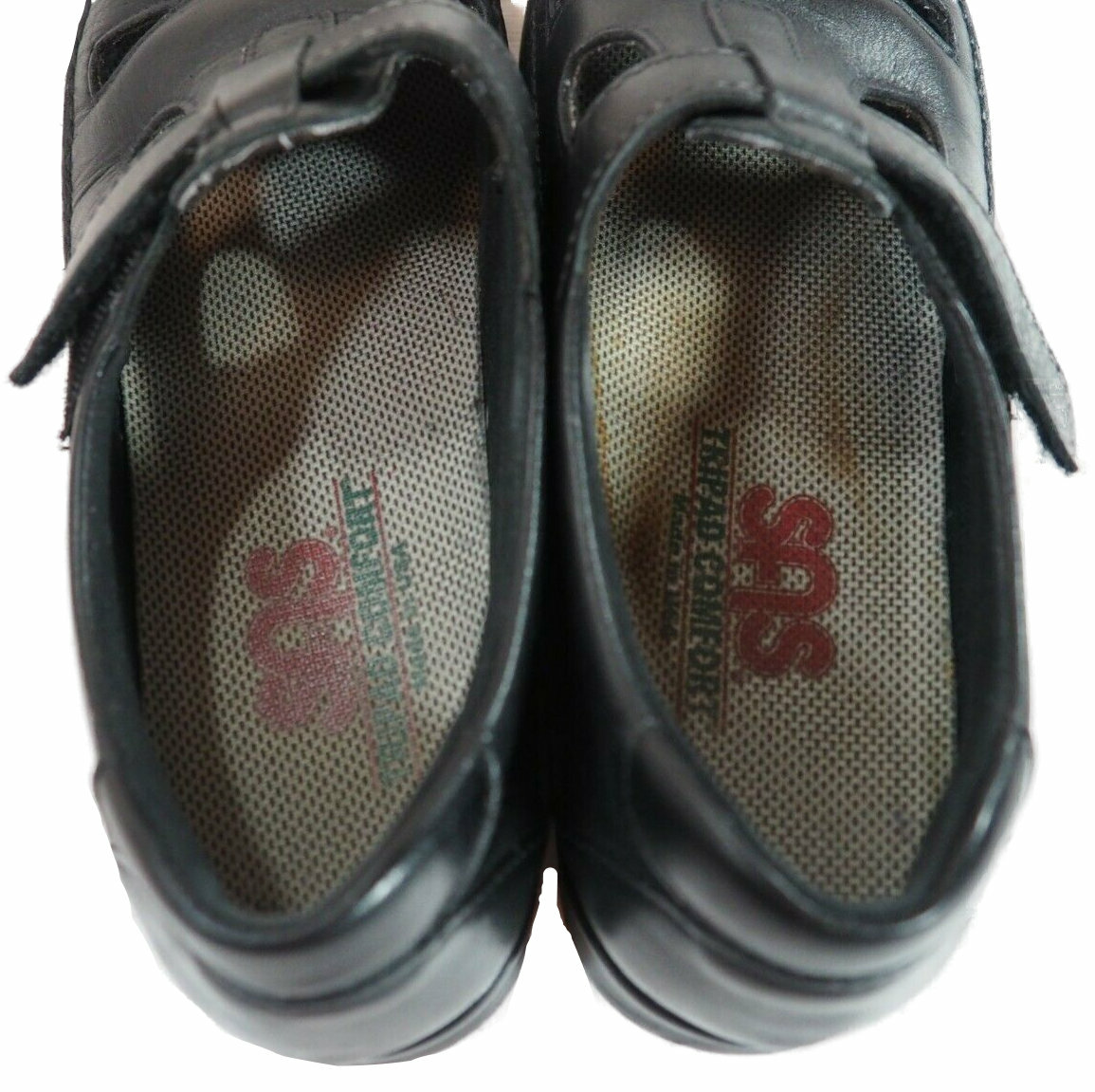 Black leather SAS Roamer women’s shoes with lace-up front, tan cushioned insole, and visible SAS logo on side.