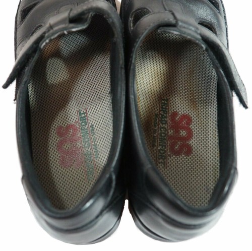Black leather SAS Roamer women’s shoes with lace-up front, tan cushioned insole, and visible SAS logo on side.