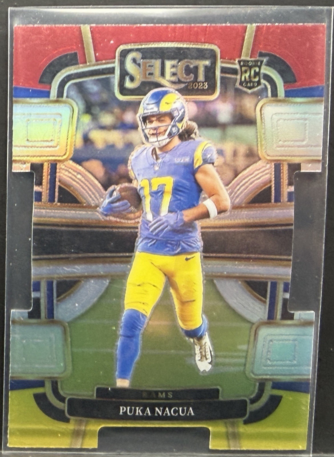 2023 Panini Select - Concourse Puka Nacua #56 Red & Yellow Prizm Die-Cut (RC)