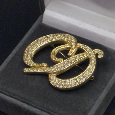 Broche Christian Dior logo CD gravure pierre ton or vintage du Japon - Photo 1/4