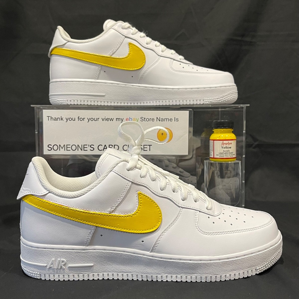 white nike air force with yellow tick
