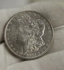 1884 O US Morgan Silver Dollar $1 AU (Cleaned)