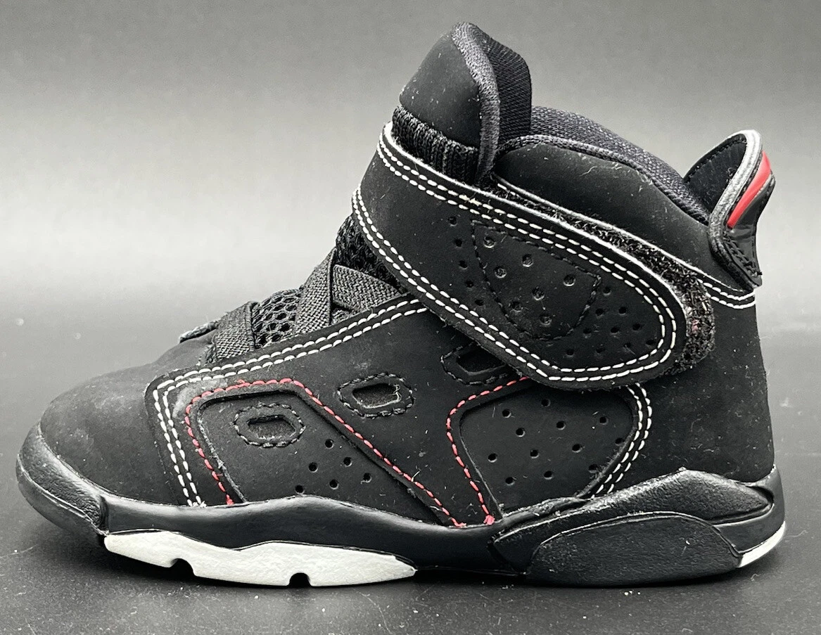 black and white jordans with red stitching