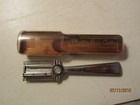 Vintage brown Playtex Hair Cutter with silver handle in clear case, labeled “Made in U.S.A.”