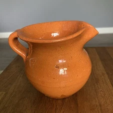 Jugtown Orange Creamer Pitcher 4"H x 3.5”W North Carolina Pottery Early Stamp