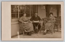 German European Man Women Outdoor Cafe Table Kronen Bitter RPPC Real Photo 1920s