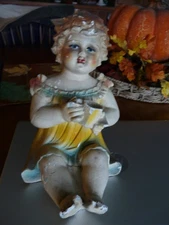 Vintage Chalkware Piano Baby Figurine - Antique Decor (circa Early 20th Century)