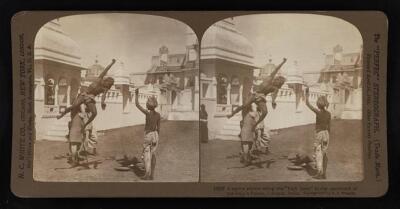 India A native athlete doing the high jump in the courtyard of th - Old Photo