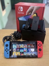 Nintendo Switch OLED 256go  Console + dock + Joy-Con Rouge/Bleu + boîte