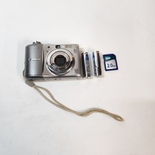 Canon PowerShot A1100 IS Silver Digital Camera Tested A+ & New Batteries SD Card