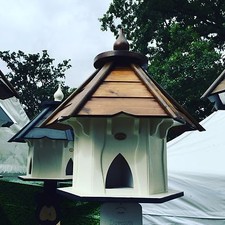 DOVECOTE DOVECOTES DOVE COTE WITH BROWN WOODEN ROOF IN CREAM